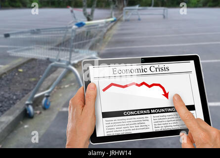 News about financial crisis reading with hand on computer tablet Stock Photo