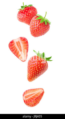 Isolated strawberries. Falling strawberry fruits whole and cut in half isolated on white background with clipping path Stock Photo