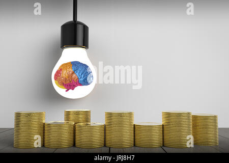 idea make money concept with colorful brain in light bulb and gold coins Stock Photo