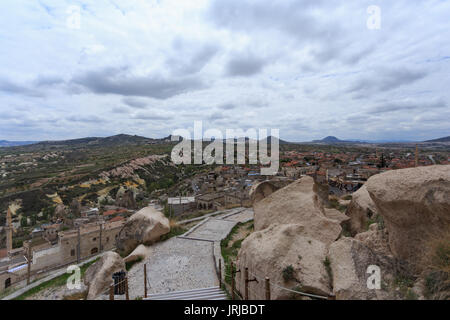 Stairs leading to top fo Uchhisar castle in Cappadocia and view over Cappadocia landscape with villages valleys and rock formations Stock Photo