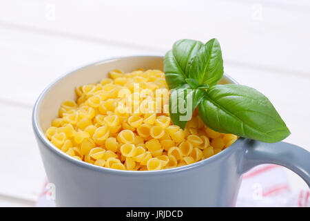 cup of small pasta shells - close up Stock Photo