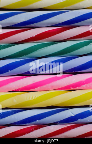 Macro background texture colorful lined up birthday cake candles Stock Photo