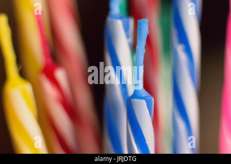 Macro background texture colorful lined up birthday cake candles Stock Photo