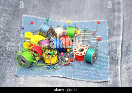 sewing kit on jeans textile Stock Photo