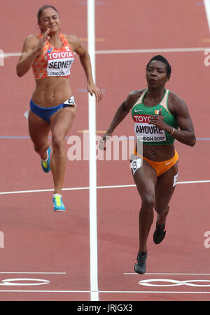 Ivory Coast's Murielle Ahoure (right) in action during the Women's 100m heat one during day two of the 2017 IAAF World Championships at the London Stadium. Stock Photo