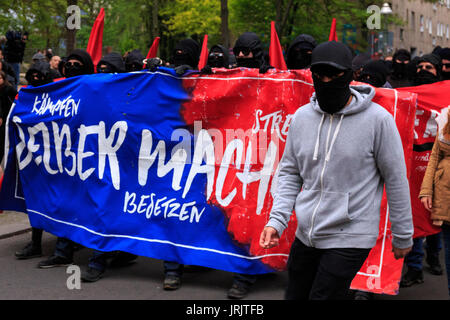 BERLIN, GERMANY - MAY 1, 2017: Black block rioters on May Day in Berlin, Germany on May 1, 2017. Stock Photo