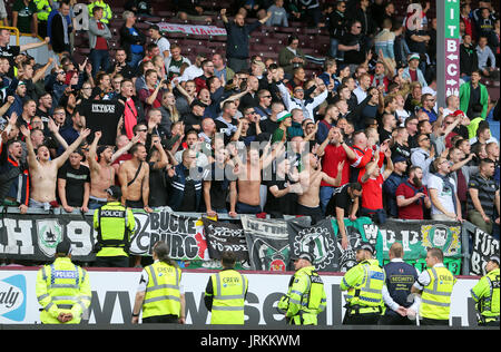 Hannover 96 ultras show their support in the stands before the pre-season friendly match at Turf Moor, Burnley. Stock Photo