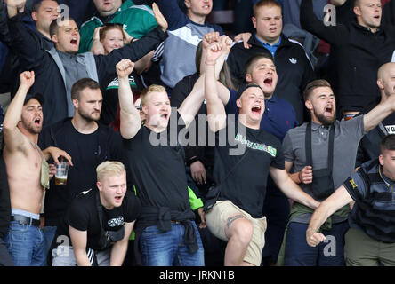 Hannover 96 ultras show their support in the stands during the pre-season friendly match at Turf Moor, Burnley. Stock Photo