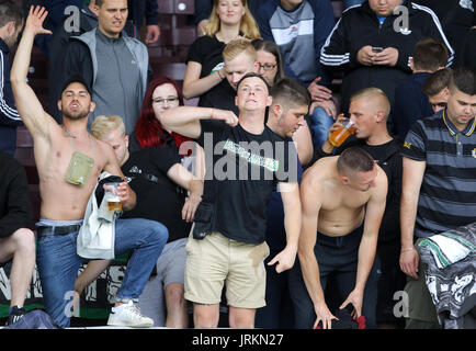 Hannover 96 ultras show their support in the stands during the pre-season friendly match at Turf Moor, Burnley. Stock Photo