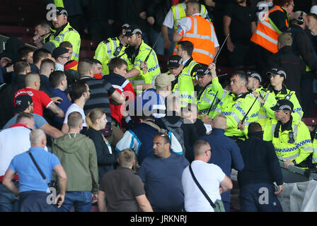 Police contain Hannover 96 ultras in the stands during the pre-season friendly match at Turf Moor, Burnley. Stock Photo