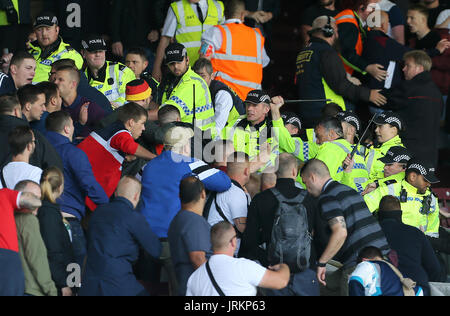 Police contain Hannover 96 ultras in the stands during the pre-season friendly match at Turf Moor, Burnley. Stock Photo