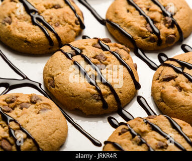 brown chocolate biscuits with syrup on white table Stock Photo