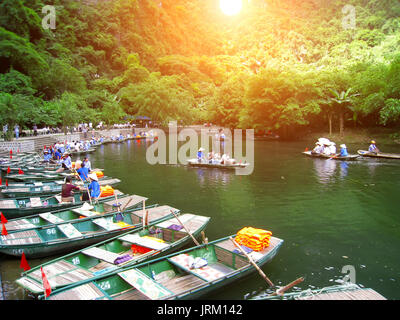 NINH BINH, VIETNAM, JULY, 20: Unidentified tourists in Trang An  on JULY, 20, 2013. Trang An is the scenic area, ranked special of Vietnam. Stock Photo