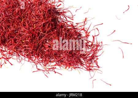 saffron crocus threads on isolated white background, view from above, flatlay Stock Photo