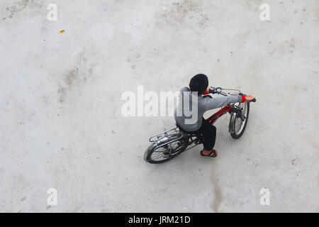 HAI DUONG, VIETNAM, DECEMBER, 6: Asian young people playing football on december, 6, 2014 in Hai Duong, Vietnam. Stock Photo