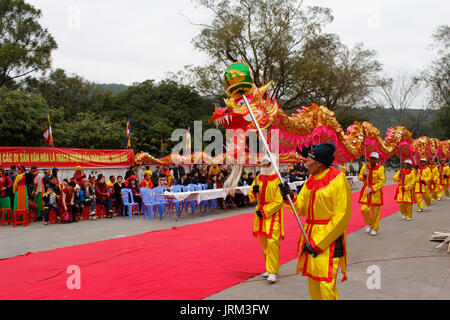 HAI DUONG, VIETNAM, February 14: a group of Asian people dance dragon in folk festivals on February 14, 2014 in Con Son pagoda, Hai Duong, Vietnam. Stock Photo