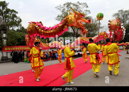 HAI DUONG, VIETNAM, February 14: a group of Asian people dance dragon in folk festivals on February 14, 2014 in Con Son pagoda, Hai Duong, Vietnam. Stock Photo