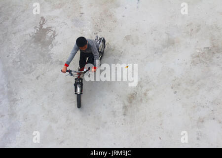 HAI DUONG, VIETNAM, DECEMBER, 6: Asian young people playing football on december, 6, 2014 in Hai Duong, Vietnam. Stock Photo