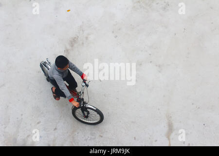 HAI DUONG, VIETNAM, DECEMBER, 6: Asian young people playing football on december, 6, 2014 in Hai Duong, Vietnam. Stock Photo