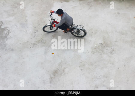 HAI DUONG, VIETNAM, DECEMBER, 6: Asian young people playing football on december, 6, 2014 in Hai Duong, Vietnam Stock Photo