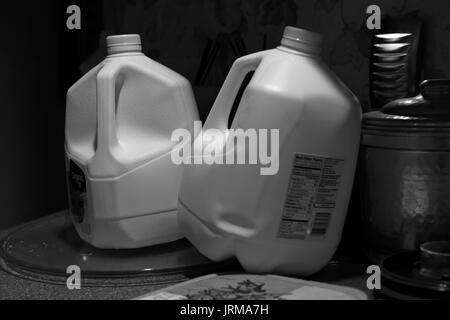 Two empty one gallon plastic milk bottles Stock Photo
