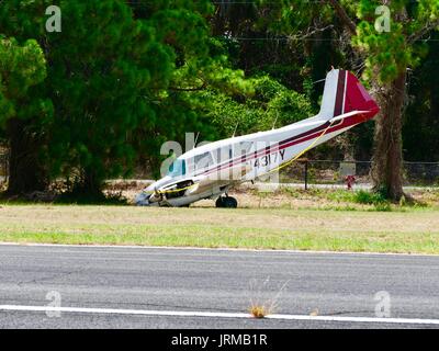 Piper PA 23 160 Apache damaged aircraft, runway overrun on 16 June 2017, no injuries, twin engine small plane, nose down. Cedar Key, Florida, USA. Stock Photo