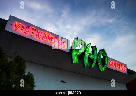 Neon sign that reads 'Vietnamese Pho Cuisine' at restaurant on Guadalupe St in Austin, Texas (restaurant is called Pho Thaison). Stock Photo