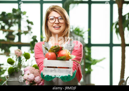 Girl with apples in store Stock Photo