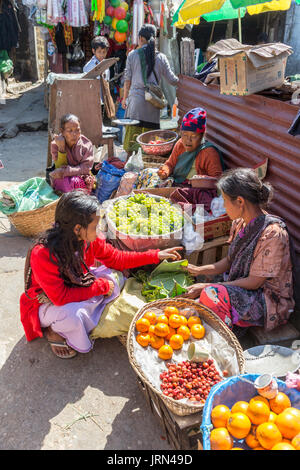 Woman buying fresh food in open air market, Mawsynram, Meghalaya, India Stock Photo