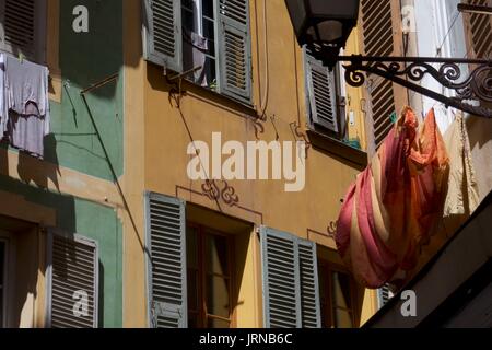 Laundry on washing line outside traditional old town apartment, Nice, France Stock Photo