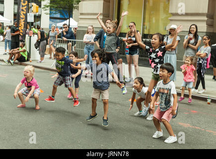 New York, United States. 05th Aug, 2017. Children play with Pop Fit Kids during Summer Streets along Park Avenue to play, run, walk, bike modeled after Bogota & Paris Credit: Lev Radin/Pacific Press/Alamy Live News Stock Photo