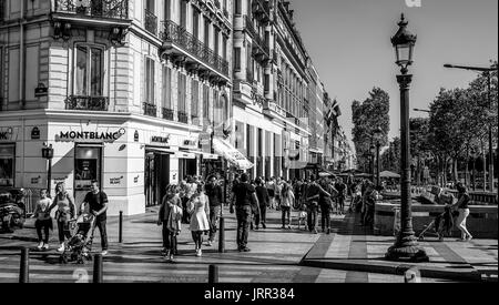 Tourists walking on Champs Elyseess boulevard - PARIS / FRANCE - SEPTEMBER 24, 2017 Stock Photo