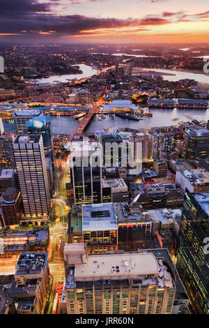 Elevated bird eye view of Sydney city CBD towards West at sunset over Darling harbour, Anzac bridge and western suburbs with setting sun. Stock Photo