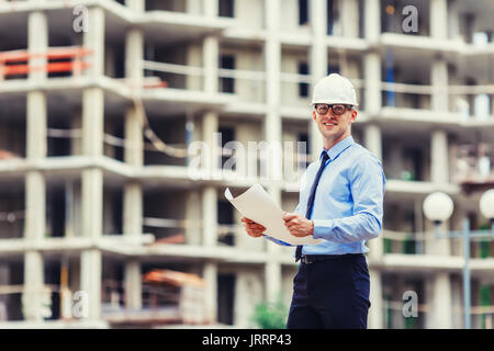 Handsom construction engineer at the construction site looking at the camera Stock Photo