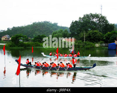 HAI DUONG, VIETNAM, March 2: People race the traditional boat on lake on March 2, 2013 in Kiep Bac – Con Son festival, Chi Linh, Hai Duong, Vietnam. K Stock Photo