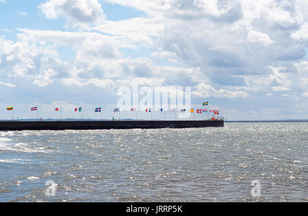 National flags of some world major global countries near the sea. Stock Photo