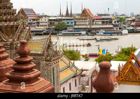 Looking across the Chao Phraya River towards the Grand Palace from Wat Arun temple complex. Yai district, Bangkok, Thailand Stock Photo