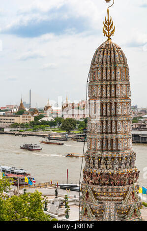 Looking across the Chao Phraya River towards the Grand Palace from Wat Arun temple complex. Yai district, Bangkok, Thailand Stock Photo