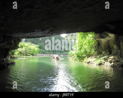 NINH BINH, VIETNAM, JULY, 20: Unidentified tourists in Trang An  on JULY, 20, 2013. Trang An is the scenic area, ranked special of Vietnam. Stock Photo