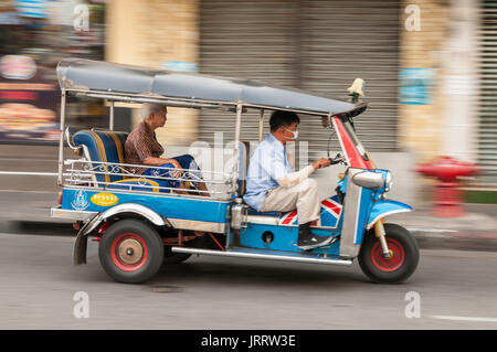 Tuktuk taxi on the road in the Banglamphu district of Bangkok, Thailand. Stock Photo