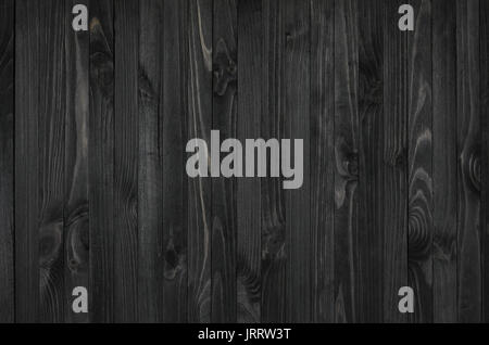 Black Wood Texture. Vertically oriented boards covered with dark stain Stock Photo
