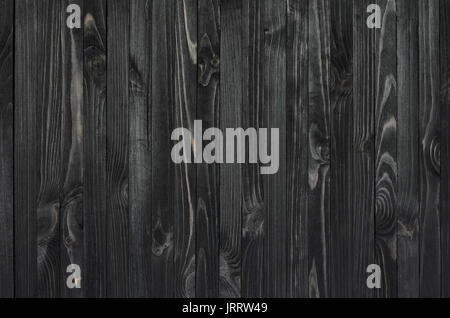 Black Wood Texture. Vertically oriented boards covered with dark stain Stock Photo