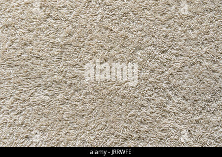 Beige Towel Texture Background. Texture of a beige towel or carpet Stock Photo