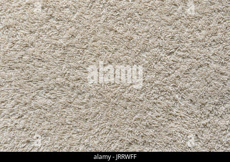 Beige Towel Texture Background. Texture of a beige towel or carpet Stock Photo