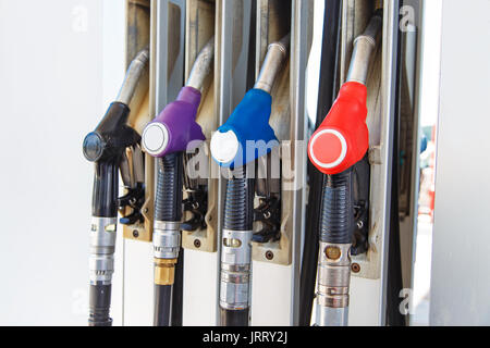 Fuel nozzle dispensing pump at gas station. The fuel for transportation concept. Stock Photo