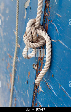 Boat Knot, Rope, Rope Knot, Sea Rope, Peeling Blue Wood, Weathered Stock Photo
