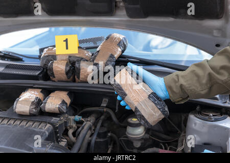 Hidden drugs in a vehicle compartment Stock Photo