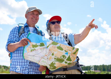 Happy Senior Couple Hiking Together Stock Photo