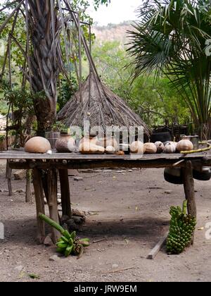 Table full of hand-made cooking pots and gourds in islolated autonomous traditional village of Boti tribe near Oinasi in West Timor, Indonesia Stock Photo