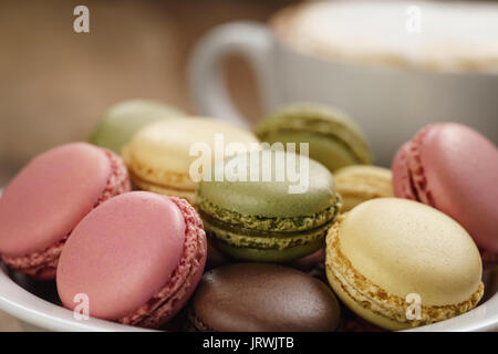 mixed macarons in bowl closeup shot Stock Photo